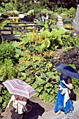 VISITORS WANDER AROUND THE ROBINSON GARDEN AT RHS HYDE HALL GARDENS