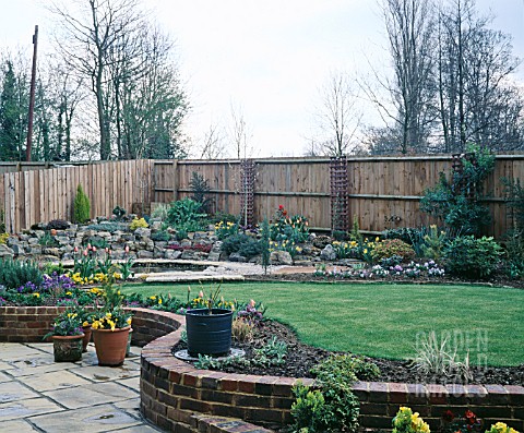 NEW_GARDEN_IN_DEVELOPMENT_APRIL__VIEW_ACROSS_THE_LAWN_TO_POND_AND_ROCKERY