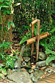 DEER SCARER IN JAPANESE GARDEN AT STAPEHILL ABBEY,  DORSET,  SEPTEMBER