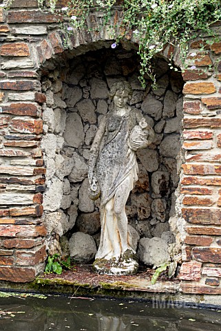 STATUARY_AT_LAMORRAN_HOUSE_GARDENS__ST_MAWES__CORNWALL_JULY