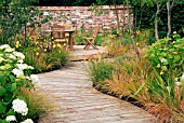 SCENE IN THE UNWIND GARDEN (ARUN LANDSCAPES LTD.) AT THE HAMPTON COURT PALACE FLOWER SHOW,  JULY 2007.