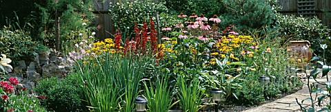 FLOWERBED_CONVERTED_FROM_A_GARDEN_POND_WITH_ECHINACEA_PURPUREA_MAGNUS_AND_RUDBECKIA_GOLDSTURM_IN_AUG