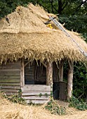 THATCHING SUMMERHOUSE AT WEST DEAN GARDENS