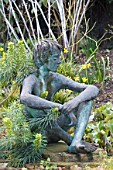 GARDEN STATUE WITH RUBUS & EUPHORBIA