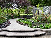 BACCHUS GARDEN  DESIGNED BY JEAN WARDROP (WARDROP DESIGNS) SILVER MEDAL WINNER WITH A THREE TIER WATER FEATURE AND GRAPE VINES.