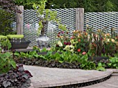 BACCHUS GARDEN  DESIGNED BY JEAN WARDROP (WARDROP DESIGNS) SILVER MEDAL WINNER WITH A THREE TIER WATER FEATURE AND GRAPE VINES.