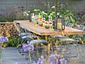 MEADOW PLANTING ON THE VESTRA WEALTHS VISTA GARDEN DESIGNED BY PAUL MARTIN WITH OUTSIDE DINING